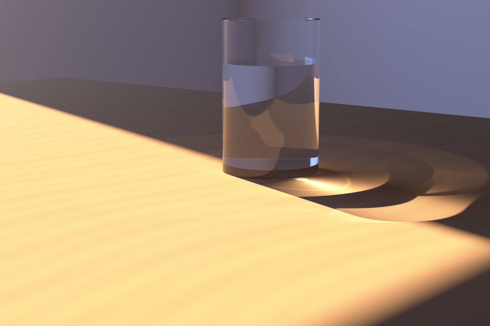 A glass of water on a wooden table in low sunlight. The glass casts a long shadow, and inside that shadow a pool of light glows — sunlight that passed through the water and was focused by it.